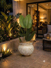 Home Sajawat artificial Bird of Paradise plant with large green leaves in an ornate white and gold textured pot.