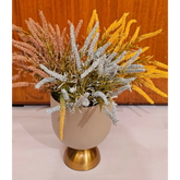 Home Sajawat artificial floral arrangement with yellow, blue, and pink textured grasses in a matte beige gold vase.