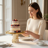 Home Sajawat decorative gold butterfly cake stand with textured gold top and creamy white base.