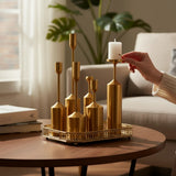 Home Sajawat decorative gold metal candlestick set with tray, featuring six varying height holders and ornate tray.