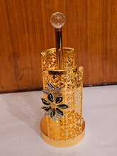 Home Sajawat gold metal paper towel holder with intricate laser-cut floral patterns and a crystal finial top