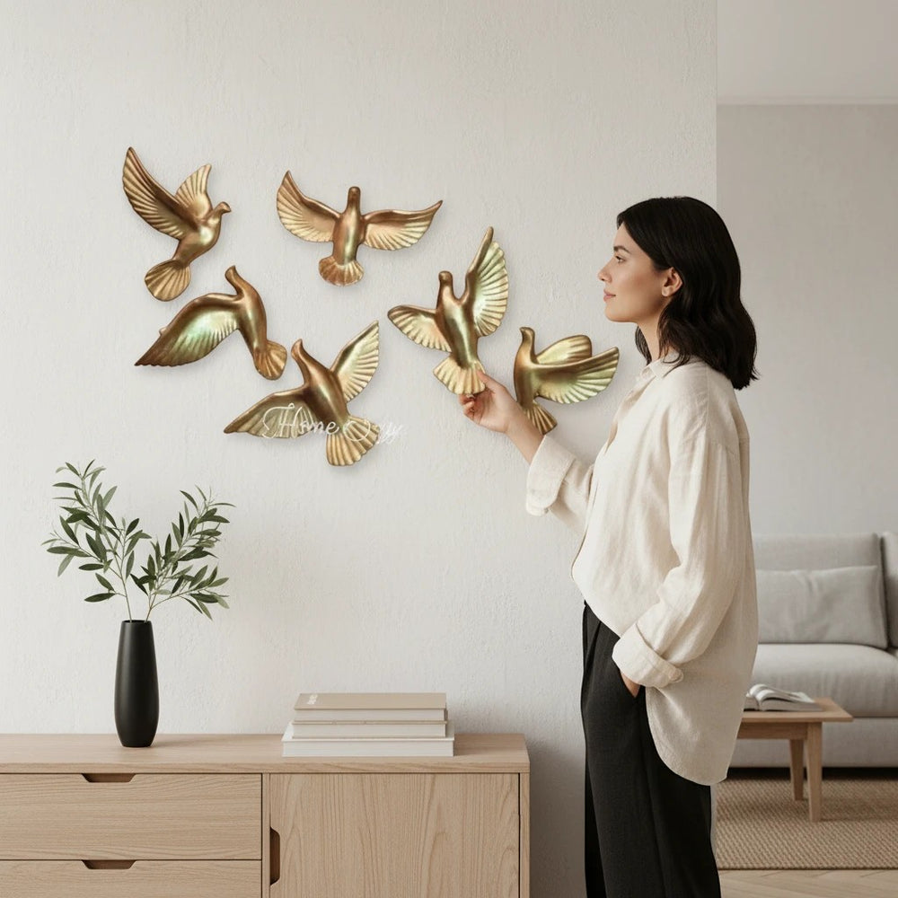 Home Sajawat set of six golden flying dove wall decor with outstretched wings, symbolizing peace and hope.