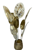 Home Sajawat decorative metal floor sculpture featuring oversized gold and white leaf panels on a textured gold base.