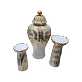 Home Sajawat white ceramic ginger jar and two pedestals with gold stripes and ruffled edges.