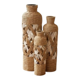 Home Sajawat set of three coastal floor vases in natural jute rope and white woven lattice in a cozy living room.