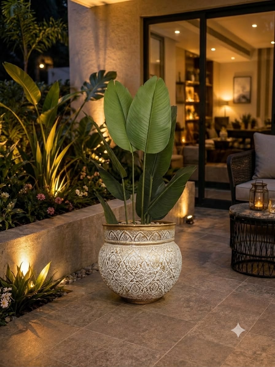 Home Sajawat artificial Bird of Paradise plant with large green leaves in an ornate white and gold textured pot.