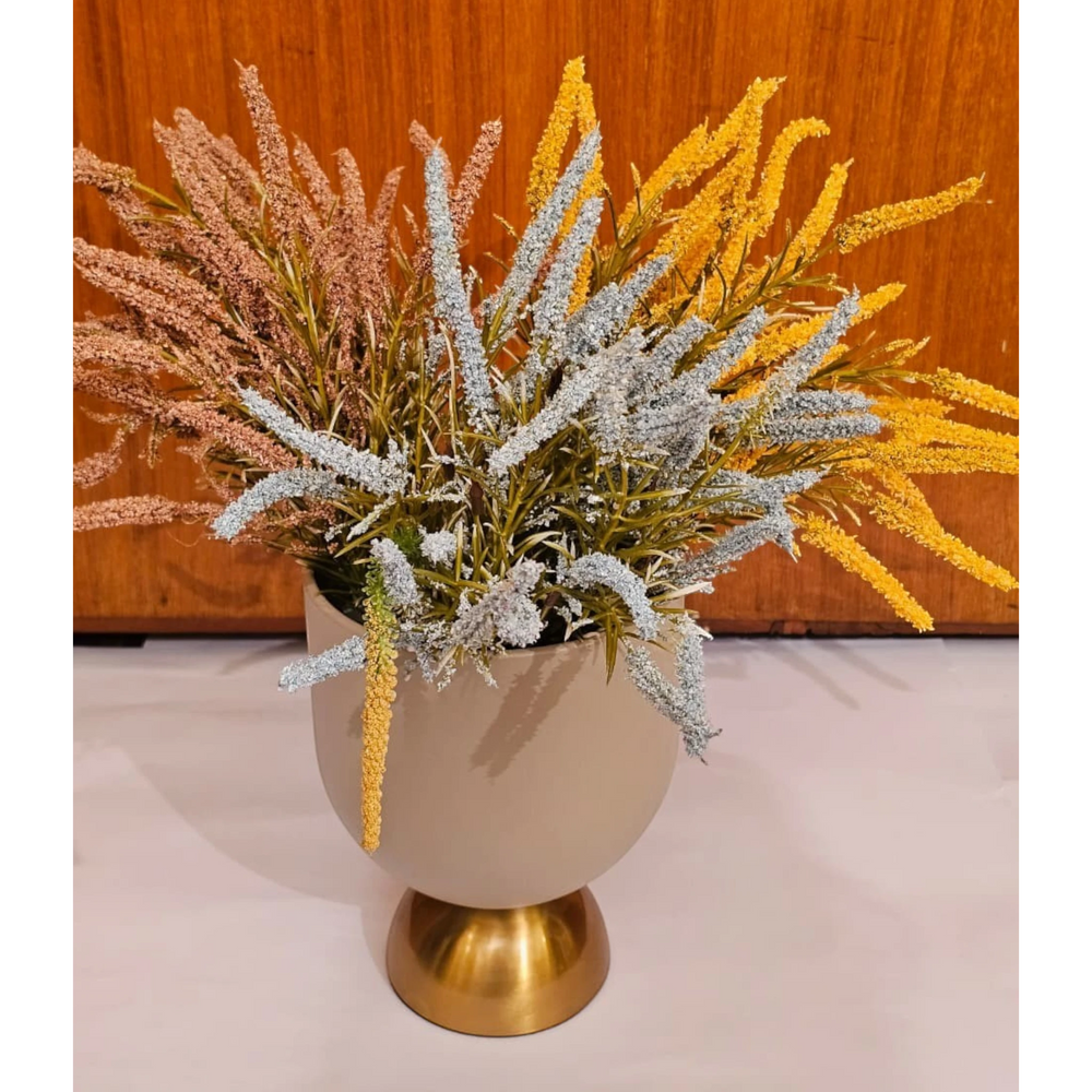 Home Sajawat artificial floral arrangement with yellow, blue, and pink textured grasses in a matte beige gold vase.