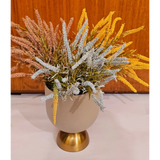 Home Sajawat artificial floral arrangement with yellow, blue, and pink textured grasses in a matte beige gold vase.