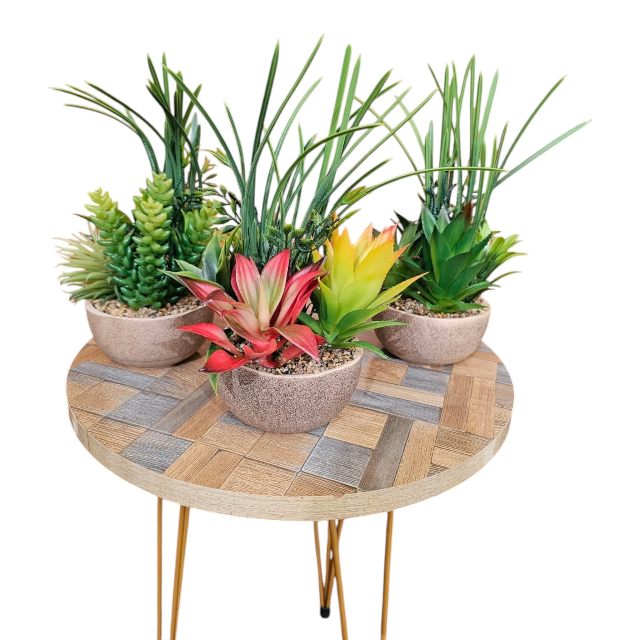 Home Sajawat set of three artificial succulent and floral arrangements in textured ceramic pots on a wooden table.
