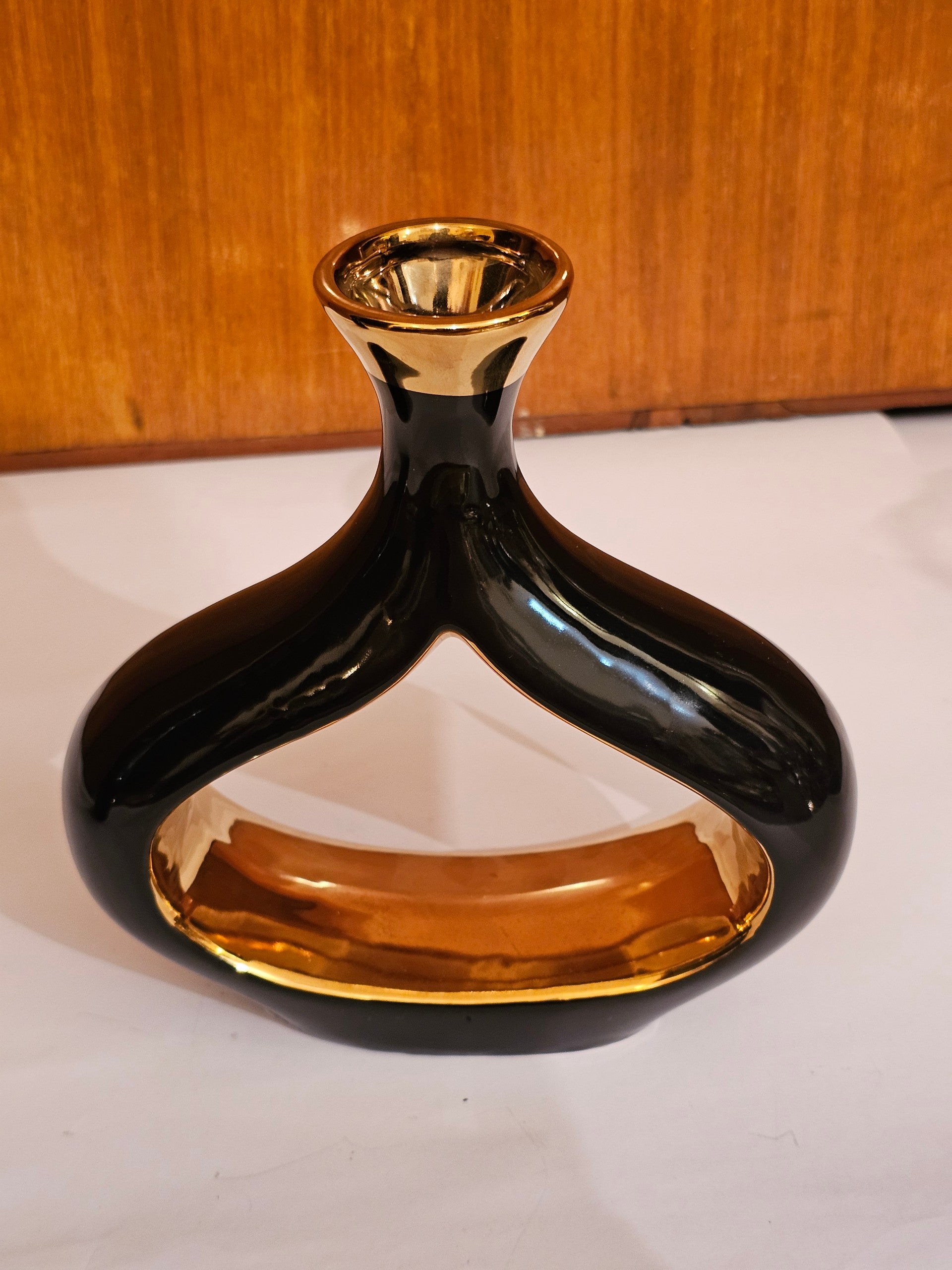 Home Sajawat modern ceramic tabletop vase with a glossy black exterior and reflective gold interior, open-center design