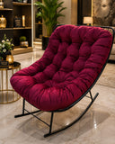 Home Sajawat plush burgundy velvet tufted rocking chair with a sleek black metal frame in a modern living room setting.