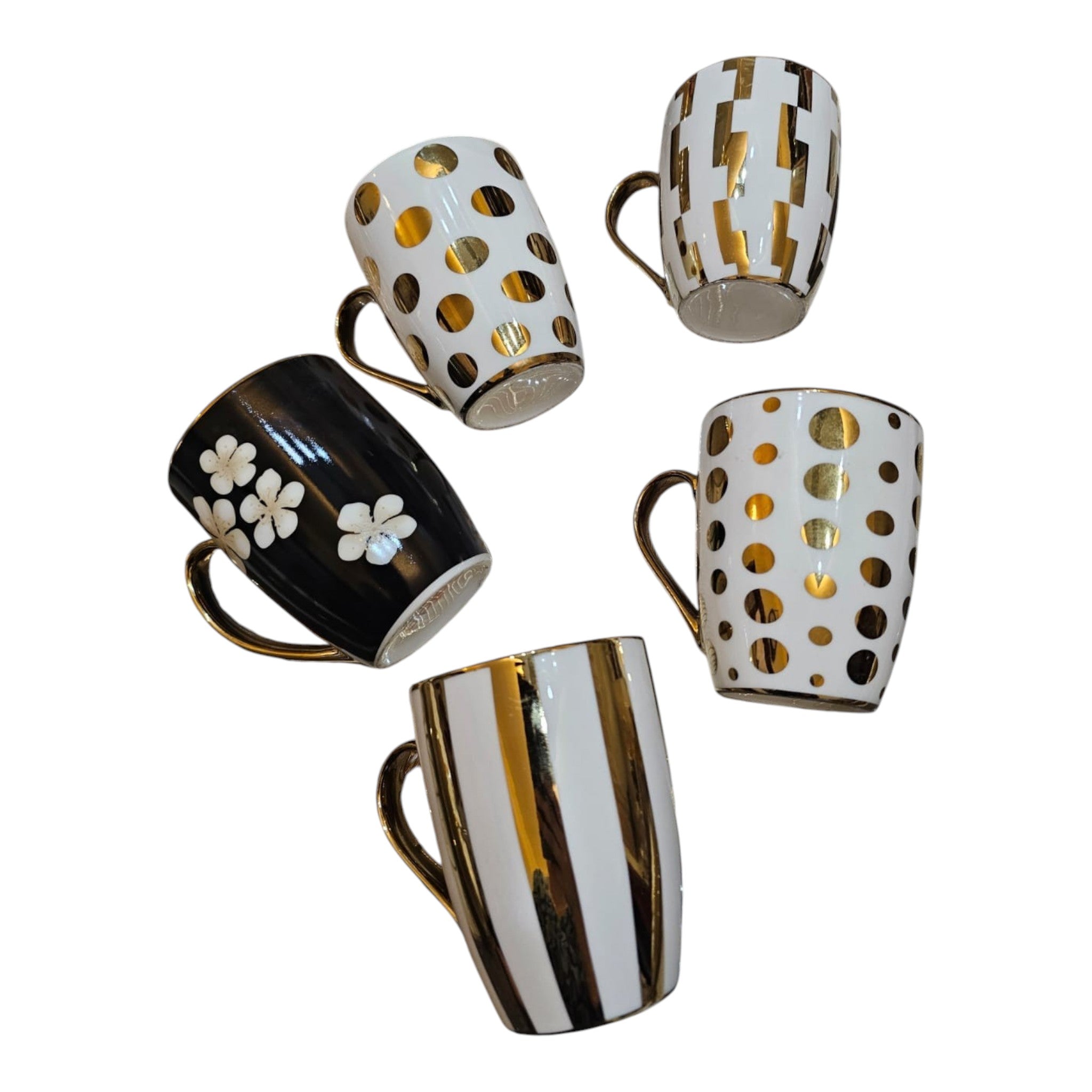 Home Sajawat ceramic coffee mug collection with gold metallic accents, featuring polka dot, floral, and striped designs.
