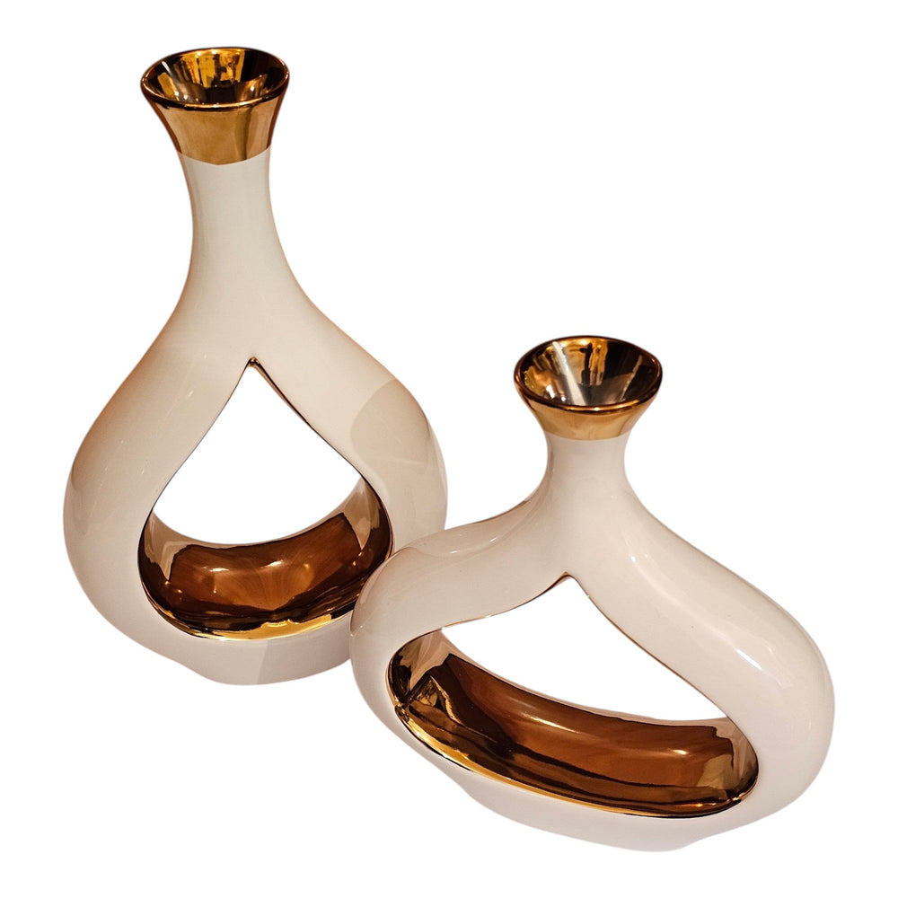 Home Sajawat set of two modern ceramic vases with glossy white exteriors and reflective gold interiors.