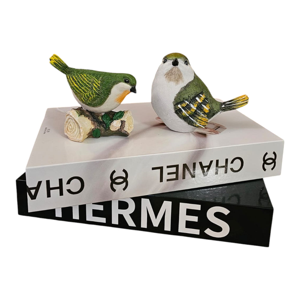 Home Sajawat decorative resin bird figurines with green and yellow hand-painted details perched on designer books