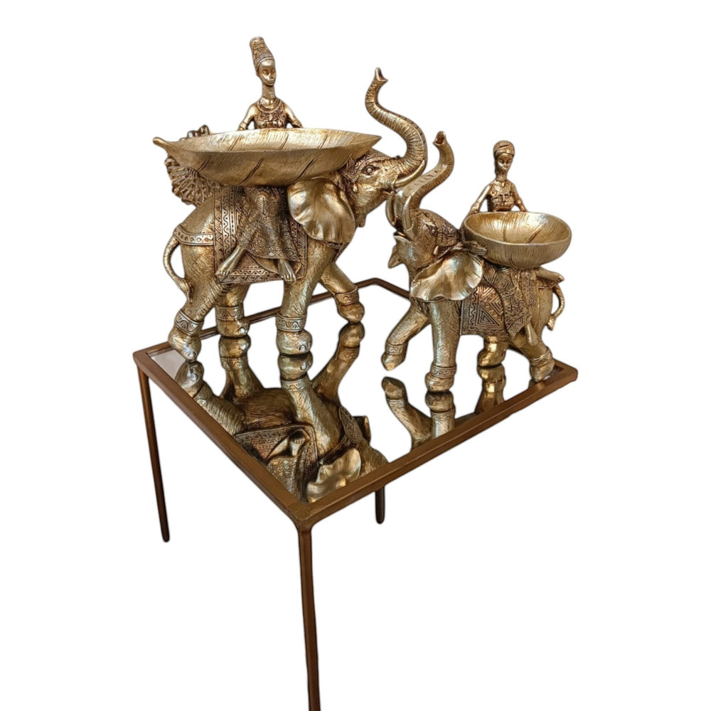 Home Sajawat antique gold elephant figurines with trays and seated figures, ornate saddles, decorative bowls.