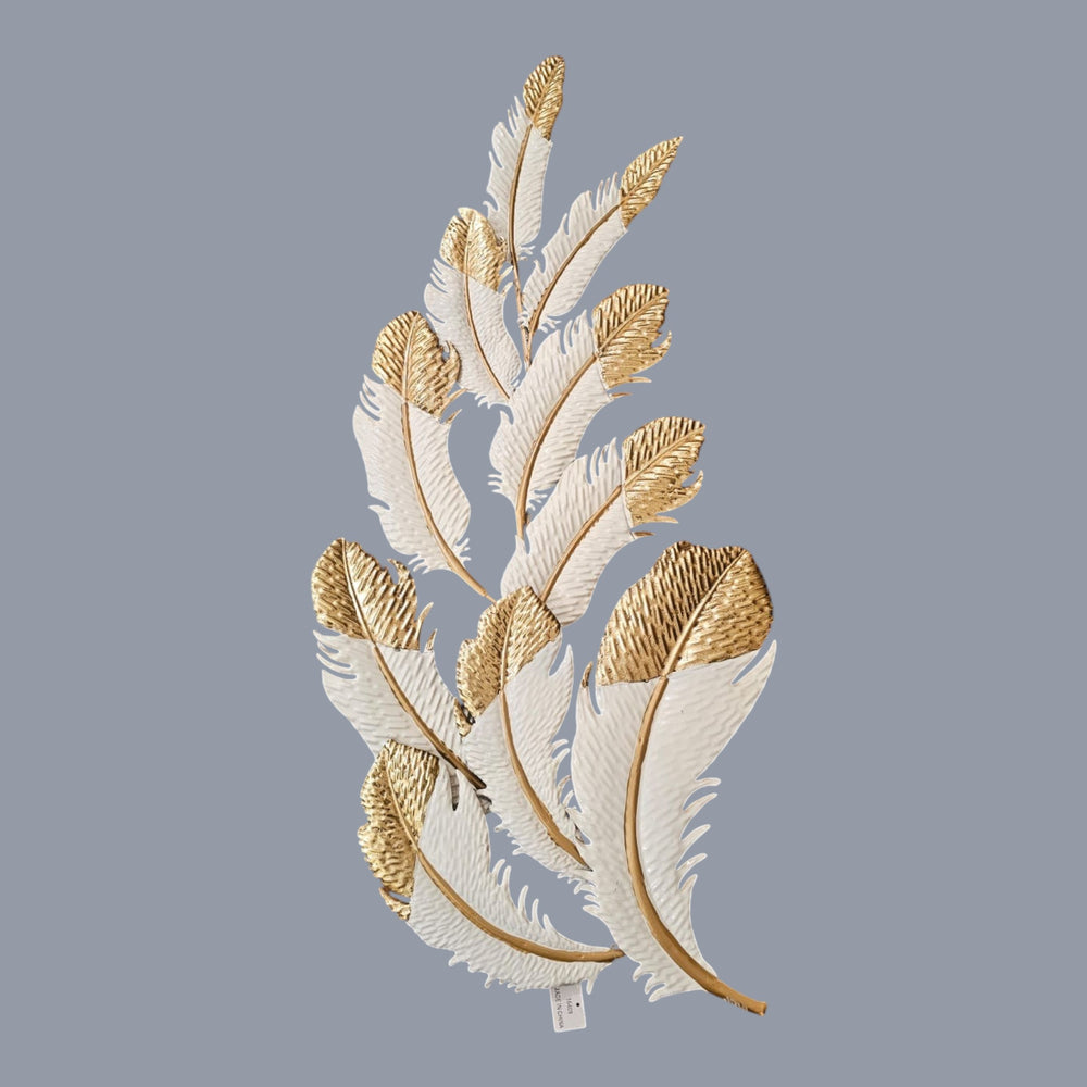 Home Sajawat white metal feather wall art with gold tips and textured detailing. Elegant sculpture.