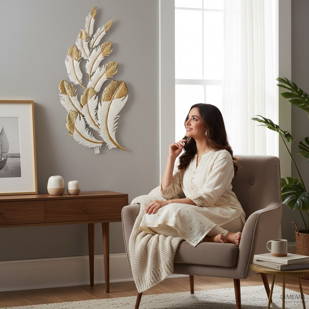 Home Sajawat white and gold metal feather wall art sculpture with intricate detailing.