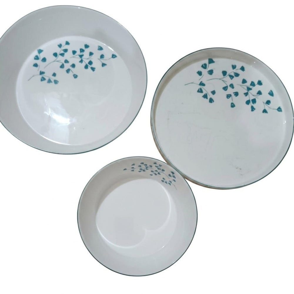Home Sajawat white porcelain serving platter with teal floral design and teal trim.