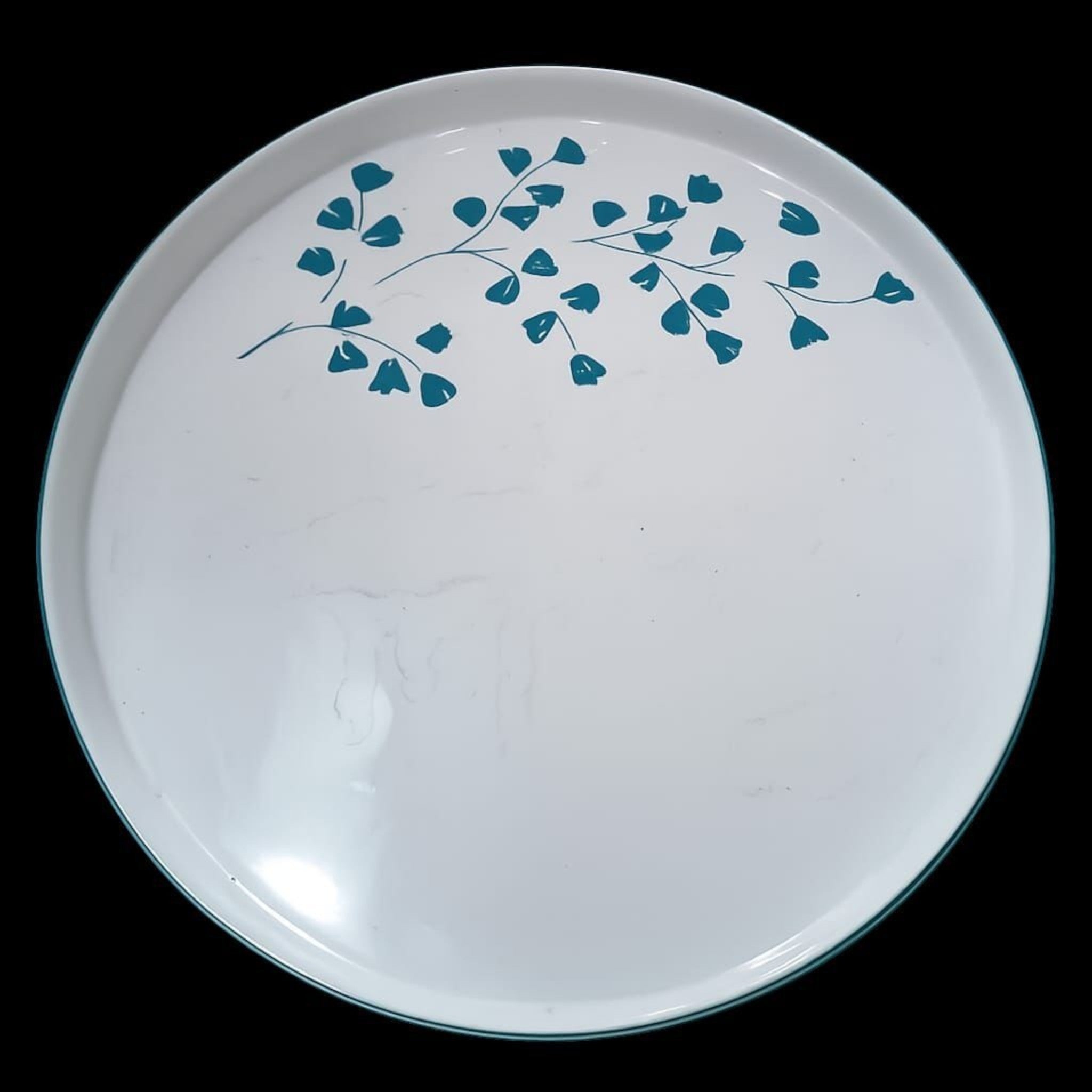 Home Sajawat white porcelain serving platter with teal floral design and dark teal rim.