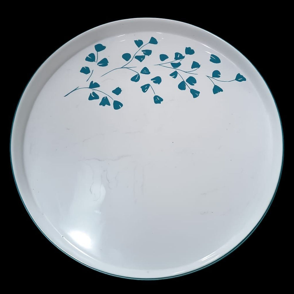 Home Sajawat white porcelain serving platter with teal floral design and dark teal rim.