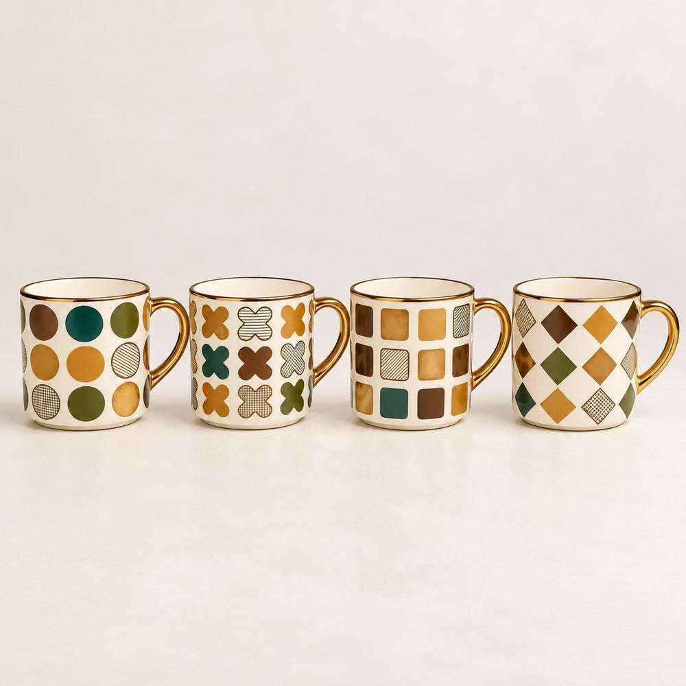 Home Sajawat set of four ceramic coffee mugs with gold rims and various geometric patterns in green and gold tones.