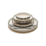 Home Sajawat white ceramic dinnerware set with black geometric pattern and gold rim. Includes plates and bowls.