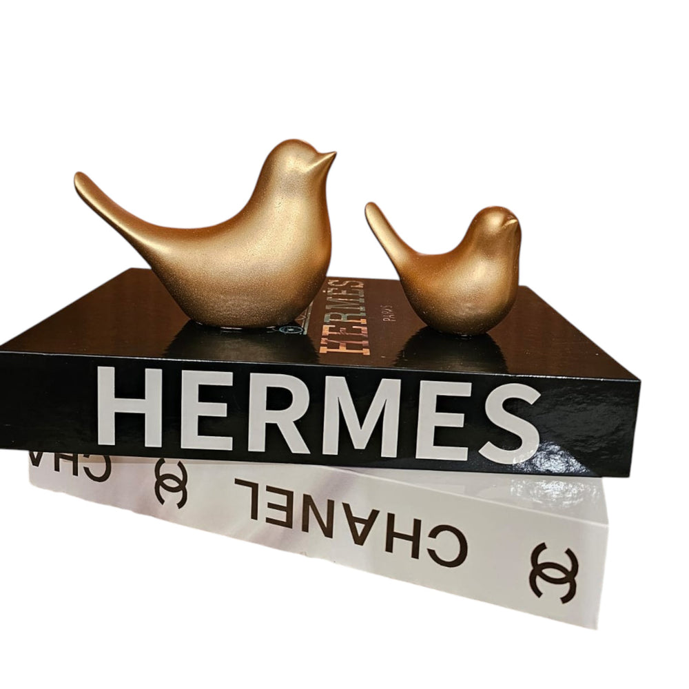 Home Sajawat set of two matte gold bird figurines displayed on top of decorative designer books.