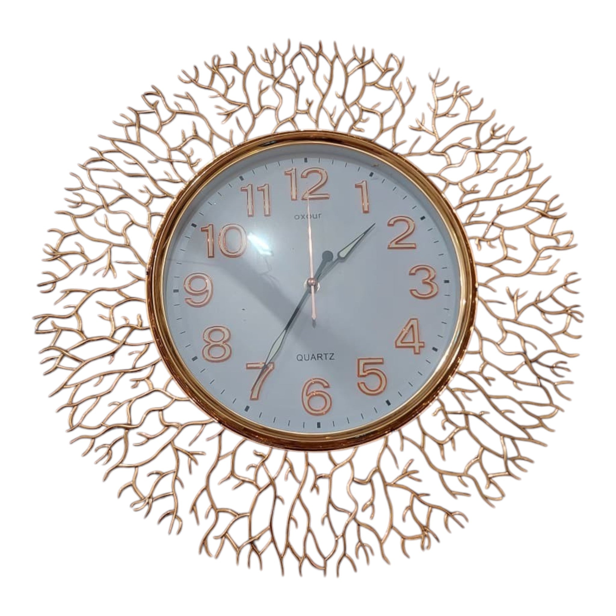Home Sajawat gold metal wall clock with intricate branch design and white face with Arabic numerals.