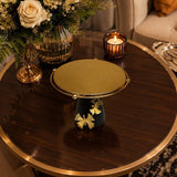 Home Sajawat decorative pedestal stand with a gold textured platform, matte black base, and gold butterfly accents.