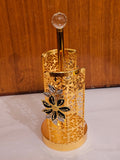 Home Sajawat gold metal paper towel holder with intricate laser-cut floral patterns and a crystal finial top