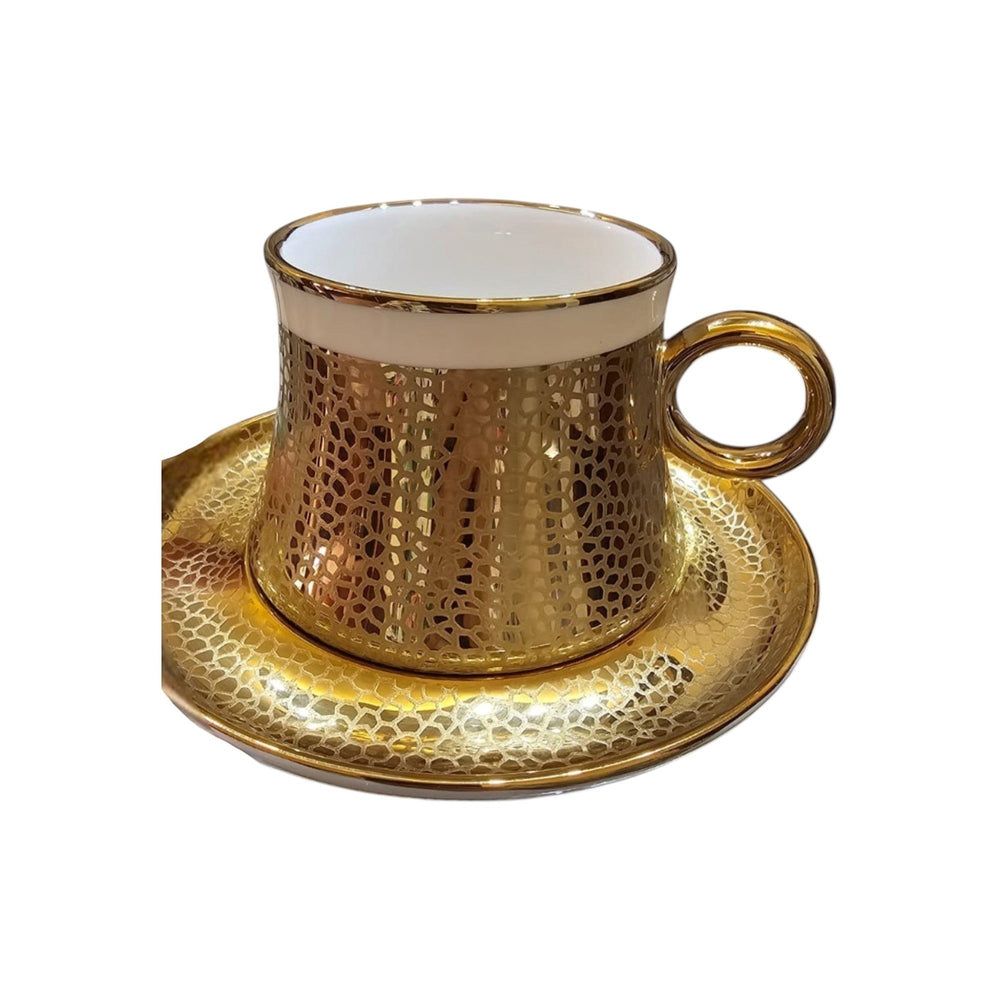 Home Sajawat hammered gold patterned ceramic coffee cup and saucer set with white interior.