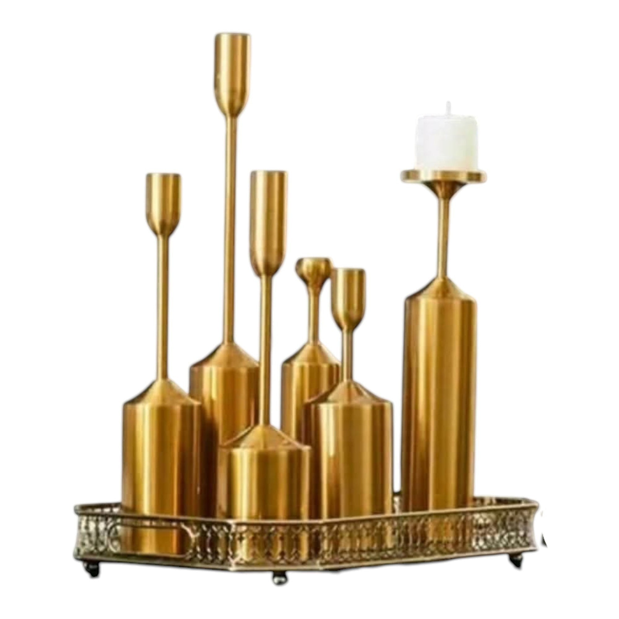 Home Sajawat decorative set of 6 gold metal taper candle holders of varying heights on an ornate tray.