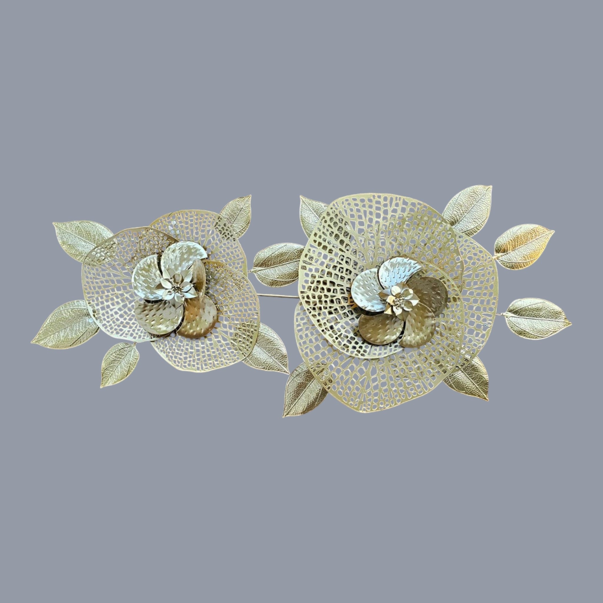 Home Sajawat set of two gold metal floral wall art decorations with intricate leaf details.