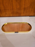 Home Sajawat oval mirrored vanity tray with a polished gold-tone metal frame and HOME label detail.