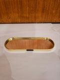 Home Sajawat oval mirrored vanity tray with a polished gold-tone metal frame and HOME label detail.
