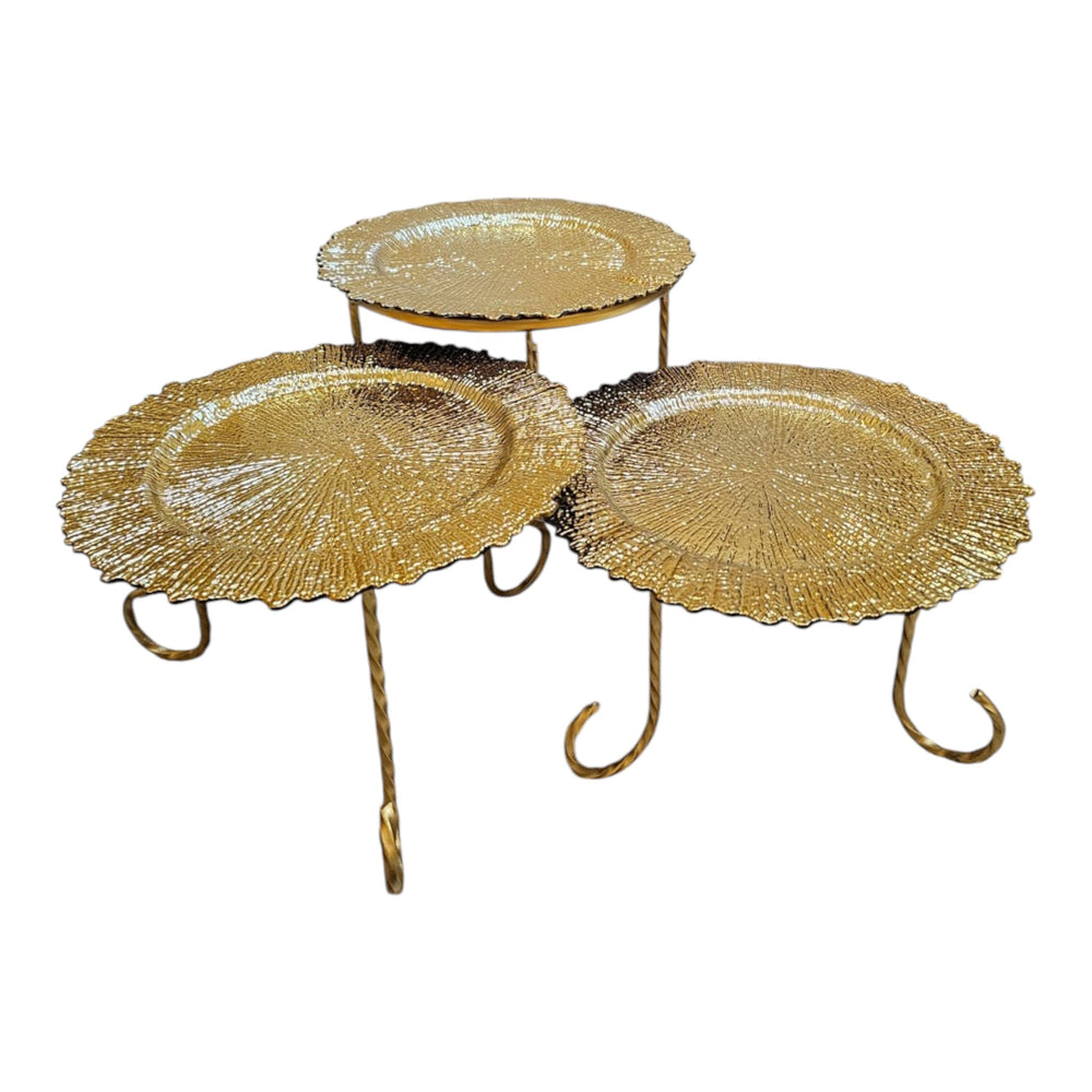 Home Sajawat set of three decorative gold tiered serving stands with textured plates and twisted metal legs.
