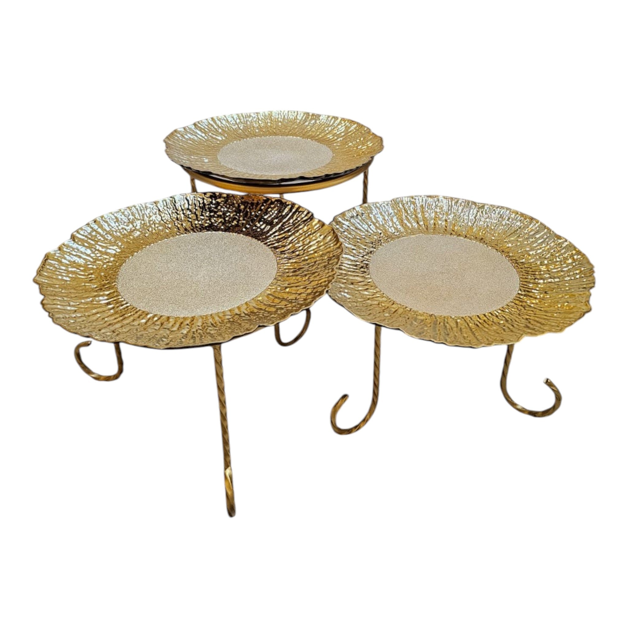 Home Sajawat set of three decorative gold tiered serving stands with textured plates and twisted metal legs.