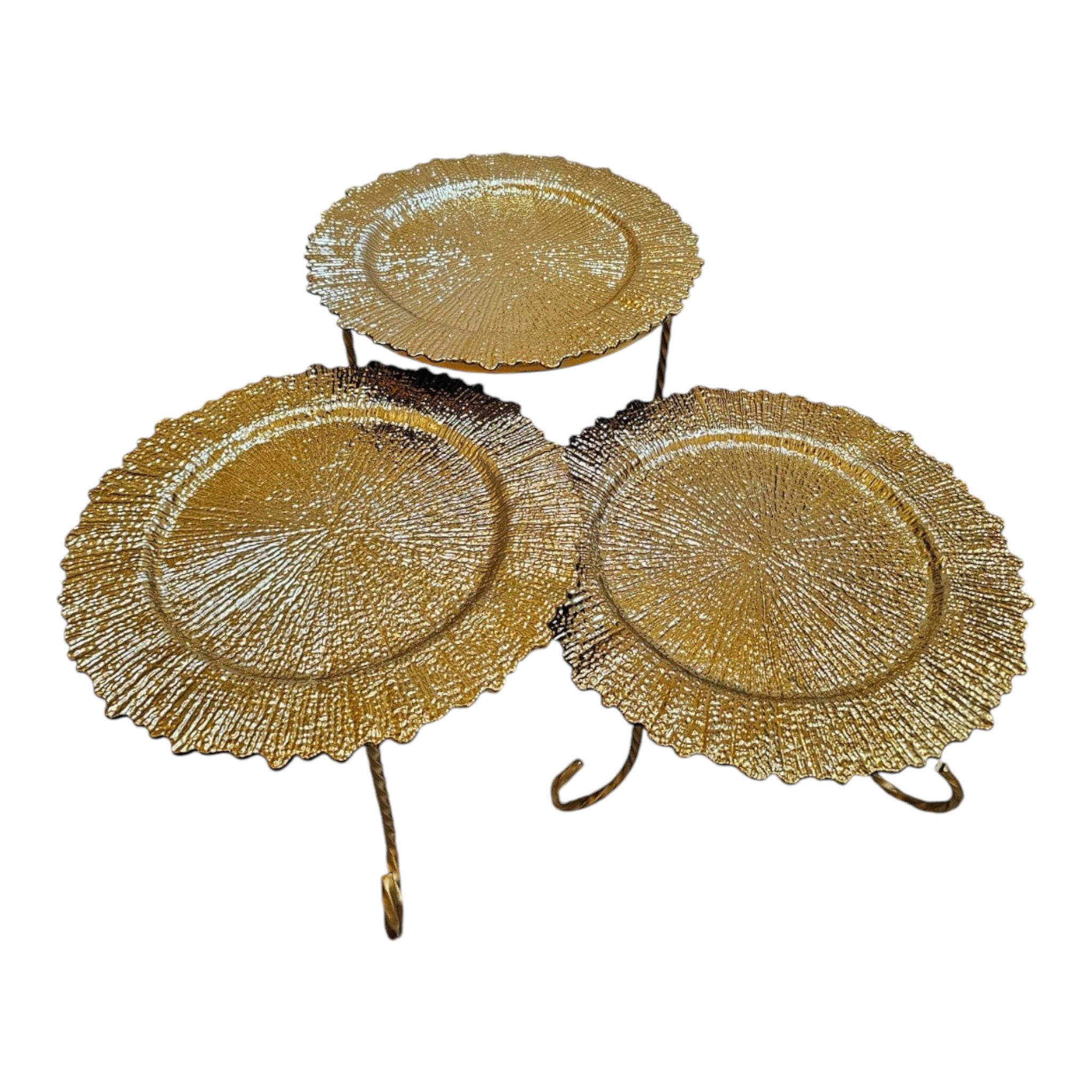 Home Sajawat set of three decorative gold serving stands with textured plates and twisted metal legs.
