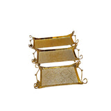 Home Sajawat set of three gold hammered metal serving trays with handles and scalloped edges.