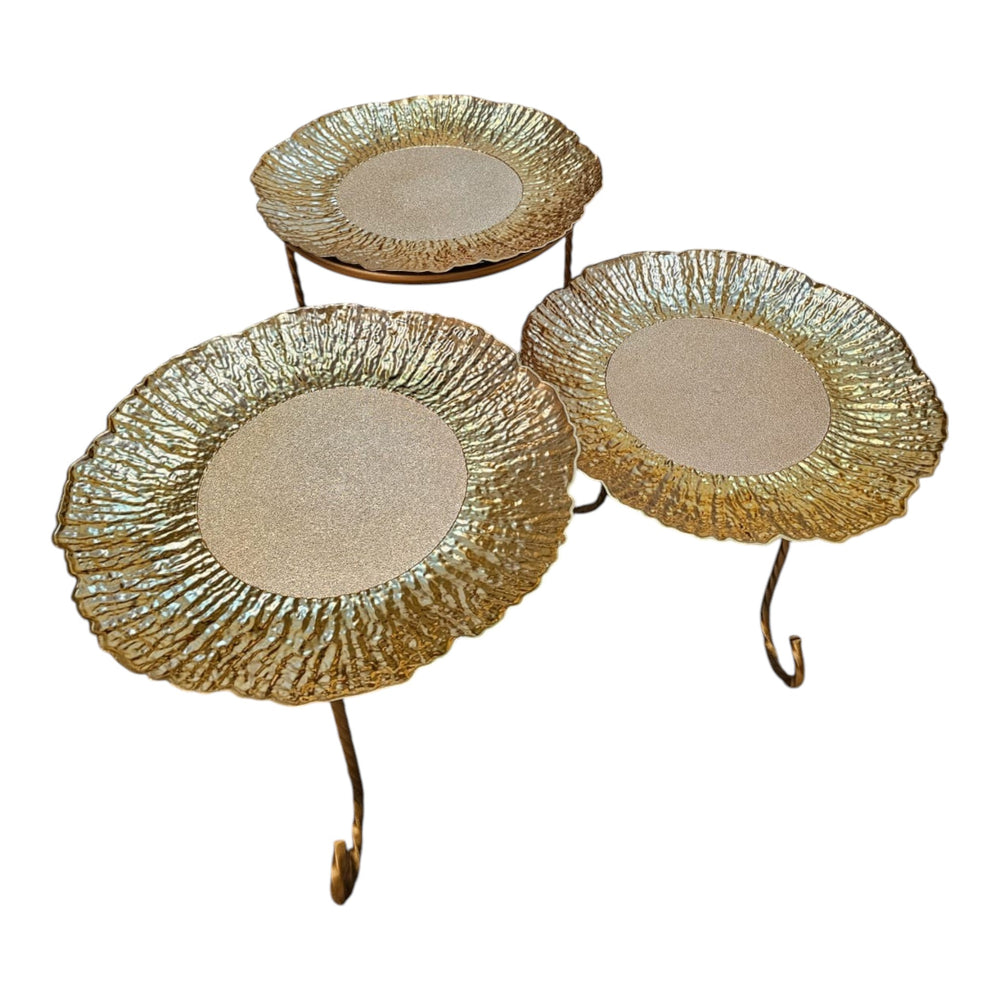 Home Sajawat set of three decorative gold tiered serving stands with textured plates and twisted metal legs.