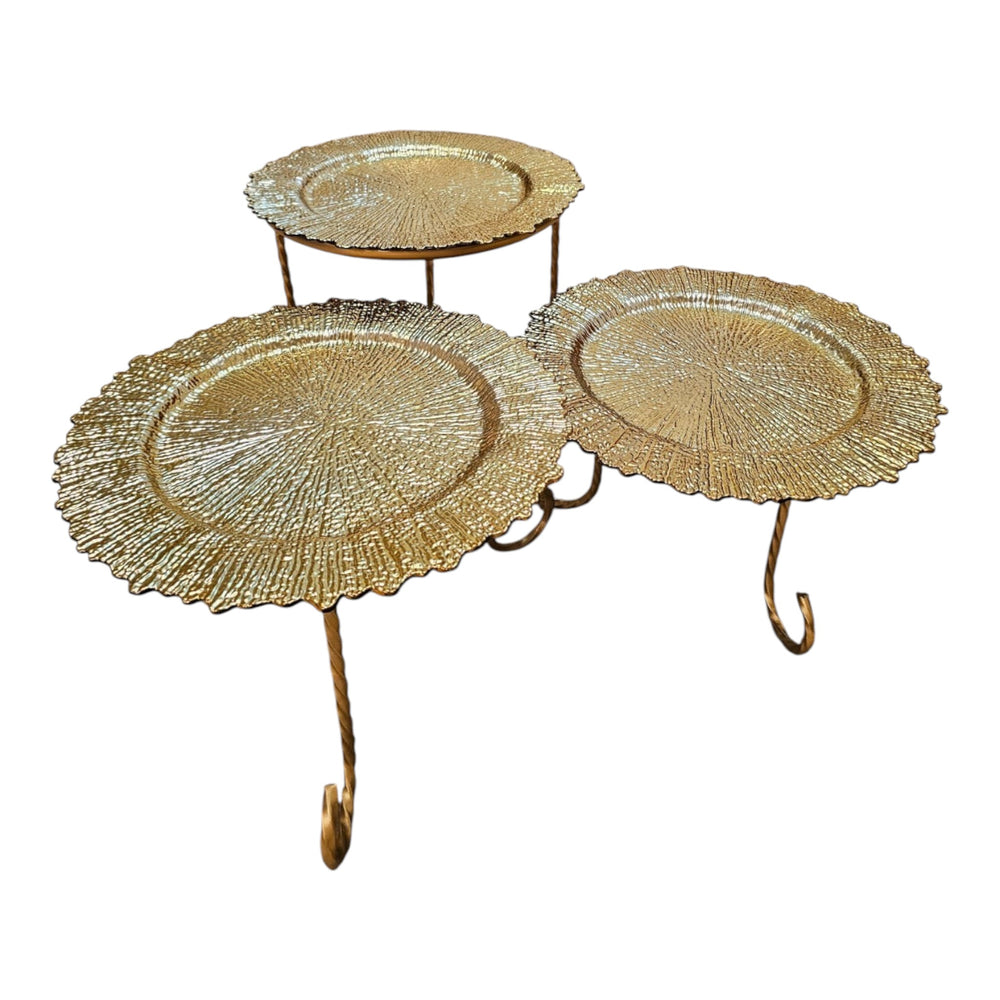 Home Sajawat set of three gold tiered serving stands with textured plates and twisted metal legs.