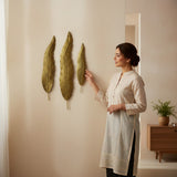 Home Sajawat set of three textured golden leaf wall art pieces. Metallic finish, natural elegance, sophisticated shine.