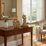 Home Sajawat set of two ornate golden peacock figurines with fanned tail feathers, displayed on a wooden console table.