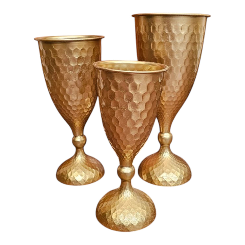 Home Sajawat set of three hammered gold metal goblets with textured finish, perfect for decorative accents.