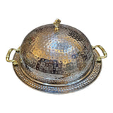 Home Sajawat hammered stainless steel serving dome with ornate gold handles and tray. Elegant hammered texture.