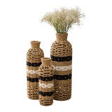Home Sajawat set of three handwoven floor vases with natural fiber, black, and white stripes for coastal home decor.