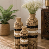 Home Sajawat set of three handwoven floor vases with black and white accents, featuring natural fiber open-weave design.