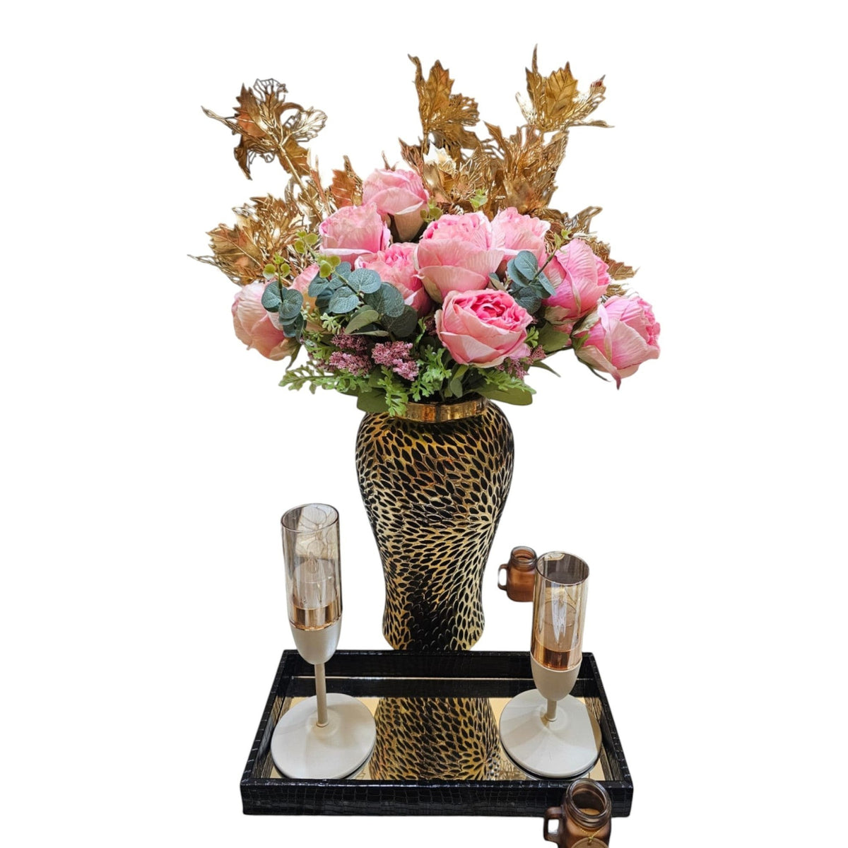 Home Sajawat black and gold leopard print ceramic vase with pink faux floral arrangement and gold accents.