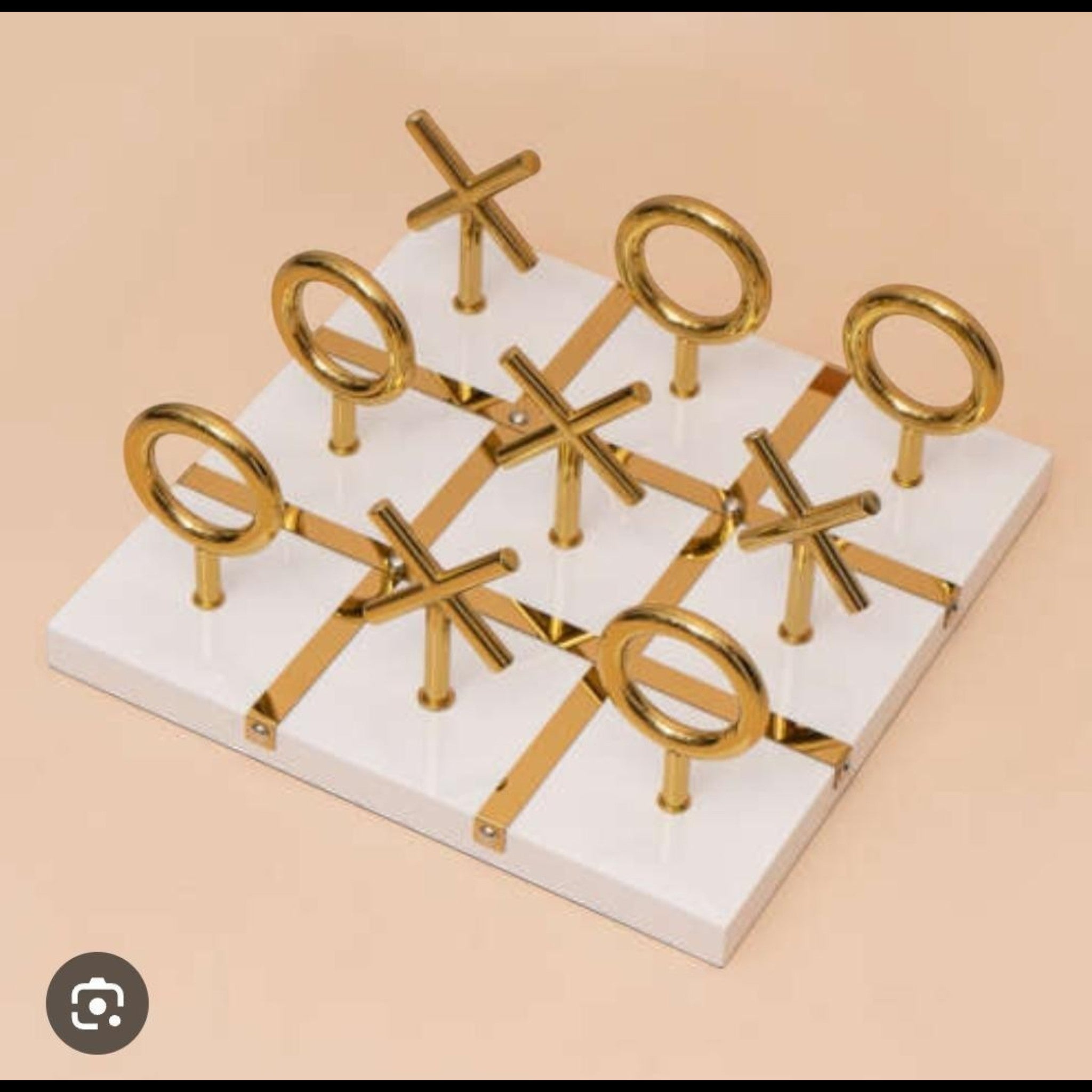 Home Sajawat luxury white Tic Tac Toe game board with gold accents and metal X O pieces.