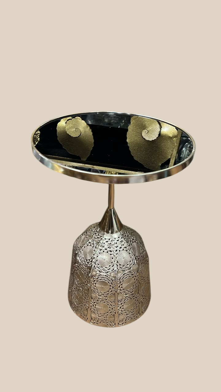 Home Sajawat decorative metal side table with a reflective circular top and an intricate laser-cut bell-shaped base.